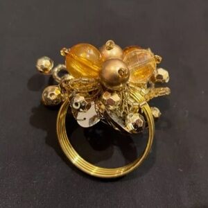World market gold napkin bead ring nwot